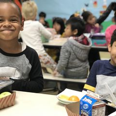 Two boys eating lunch