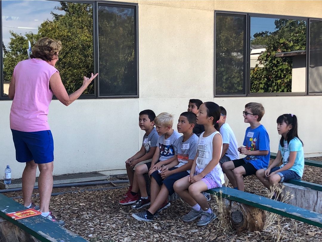 Students listening to a teacher