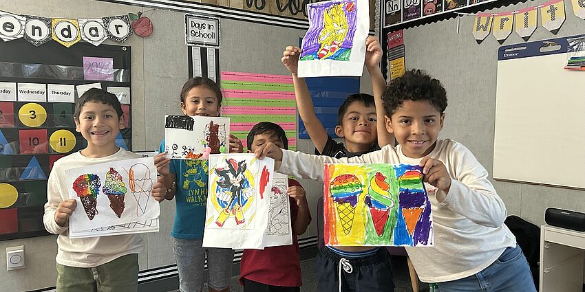 Students show off their colorful artwork