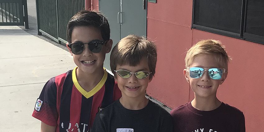 3 boys with sunglasses on.