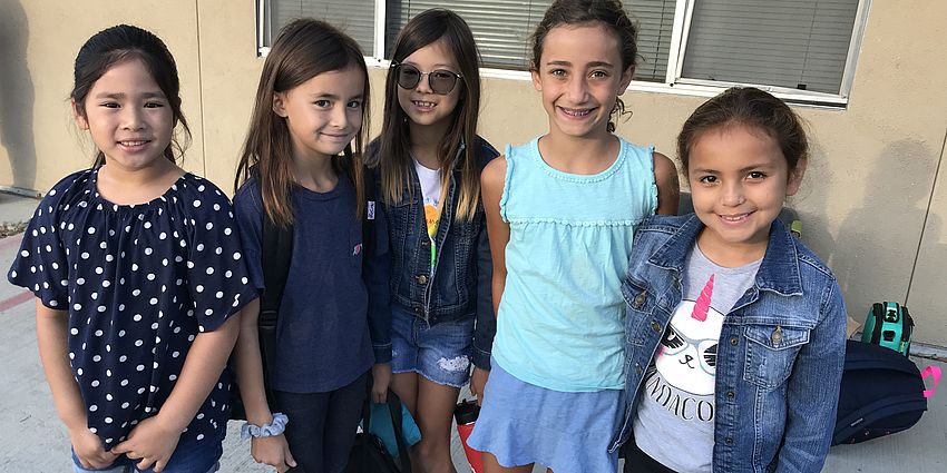 5 students smiling