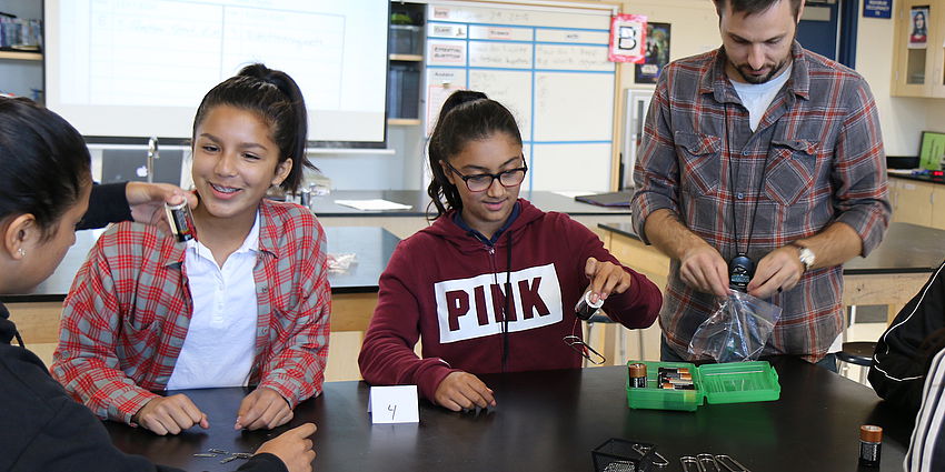 students doing a science experiment