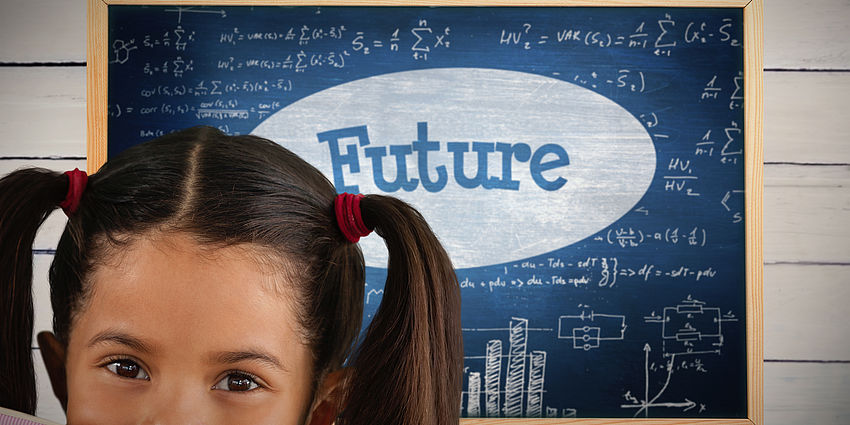 girl in front of board that says Future