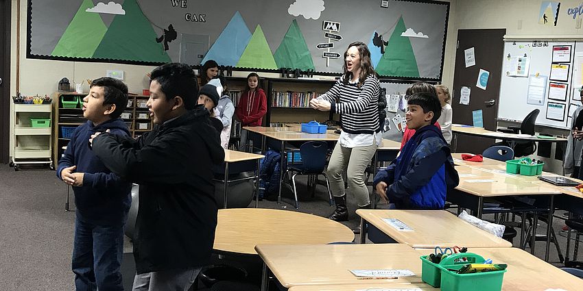 Students and principal dancing