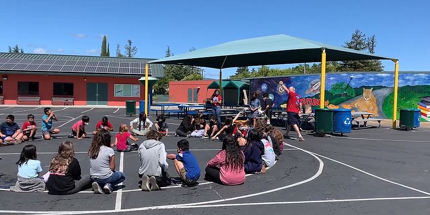 Mr. Brown and 5th Graders playing games.