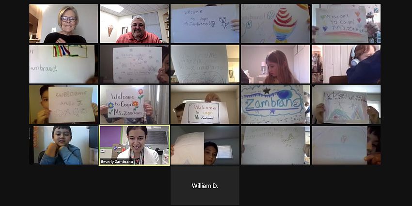 Zoom screenshot of students with signs