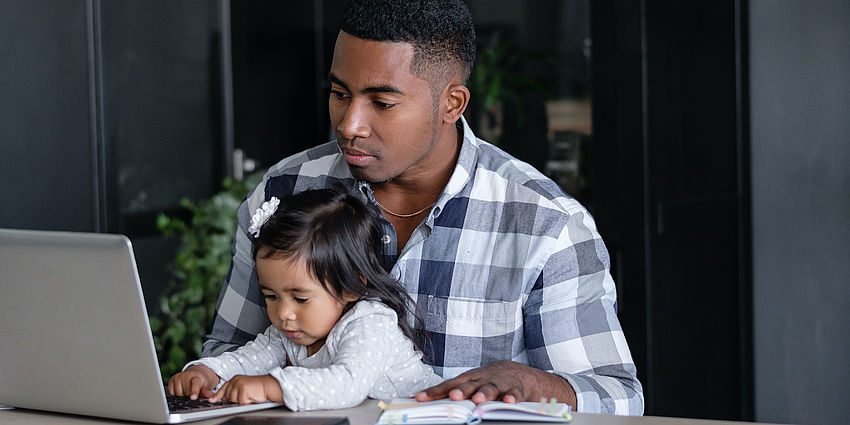 Father and daughter on a computer