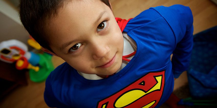 Child dressed up like superman