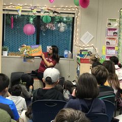Volunteer reading to a class