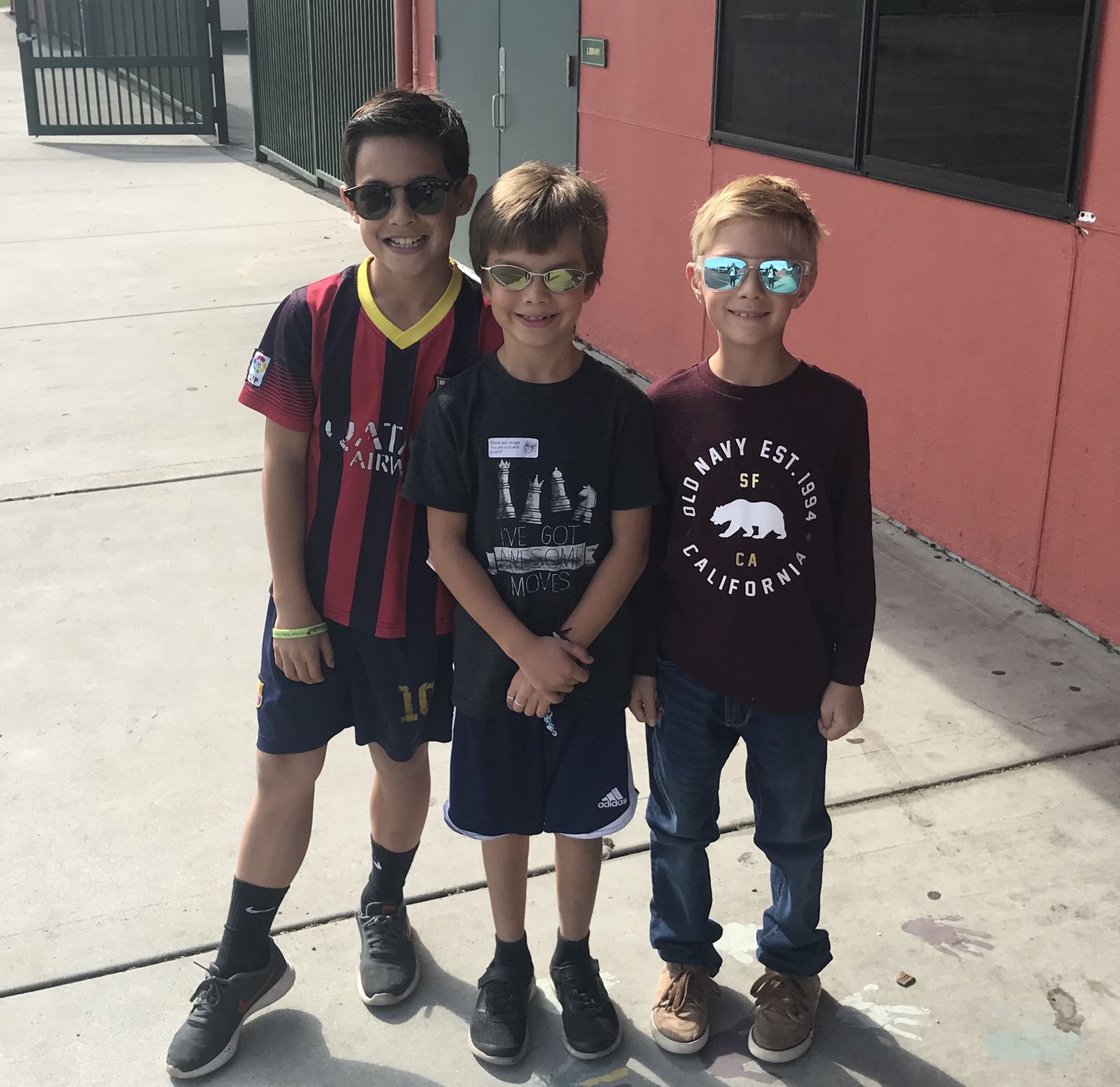 3 boys with sunglasses on.