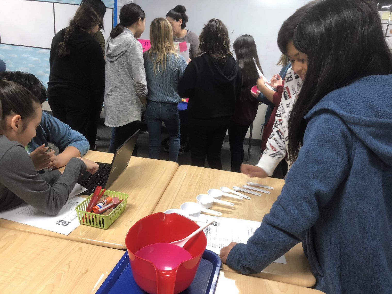 Students with measuring tools