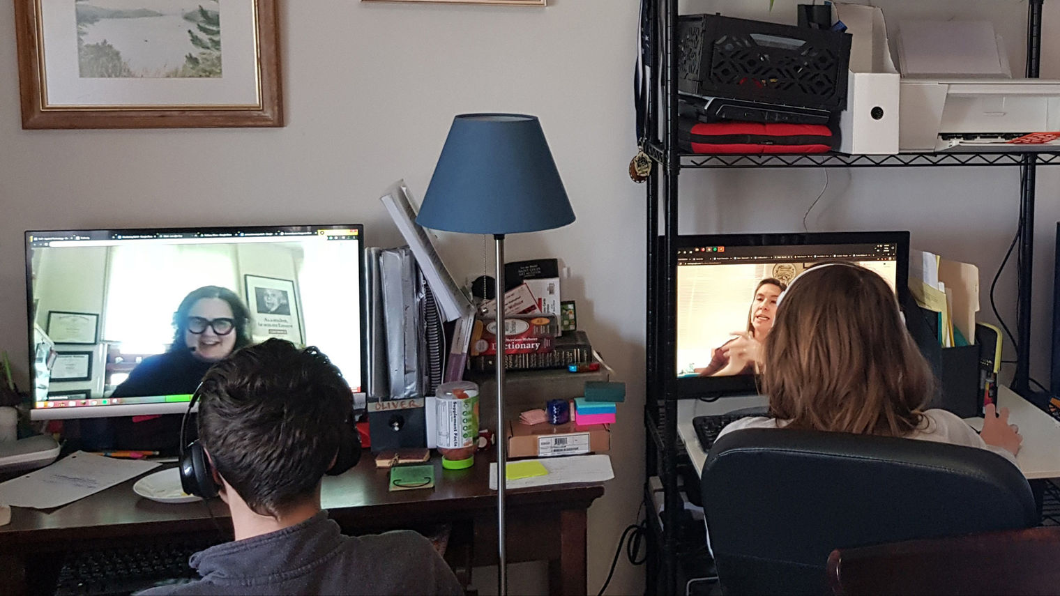 Students on computers with teachers