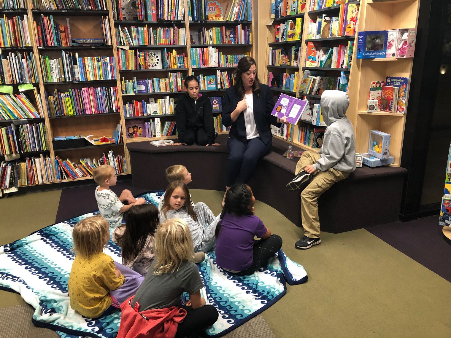 Mrs. Wellendorf reading to students