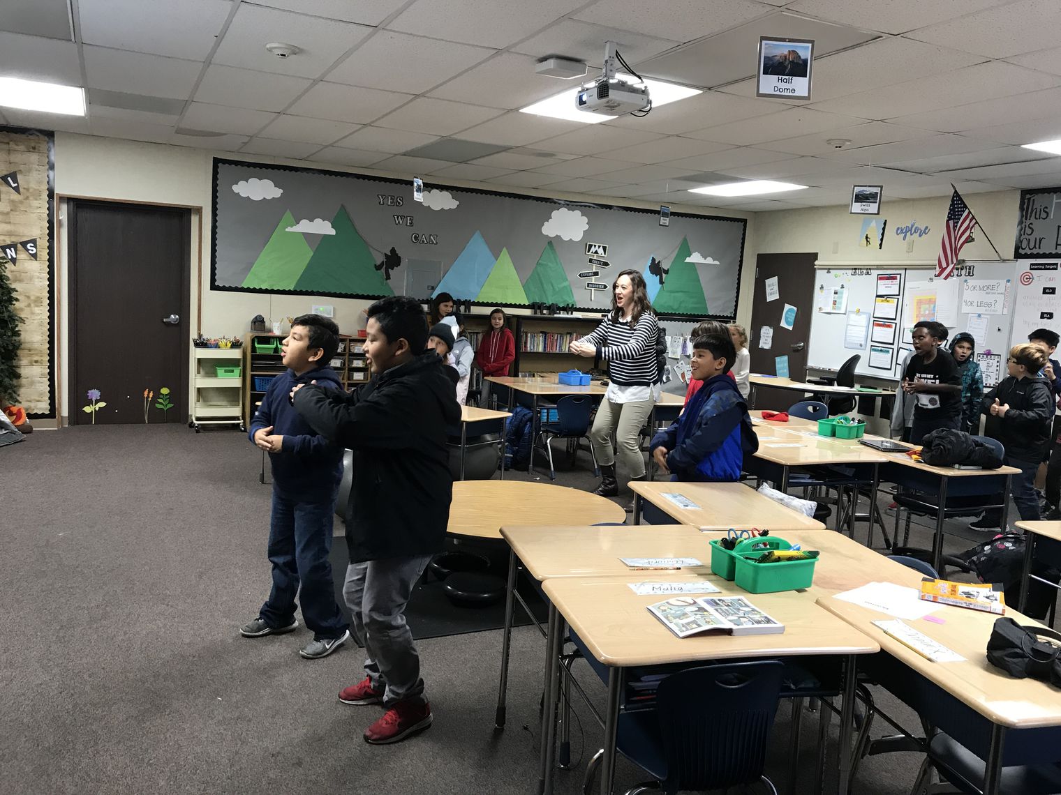 Students and principal dancing