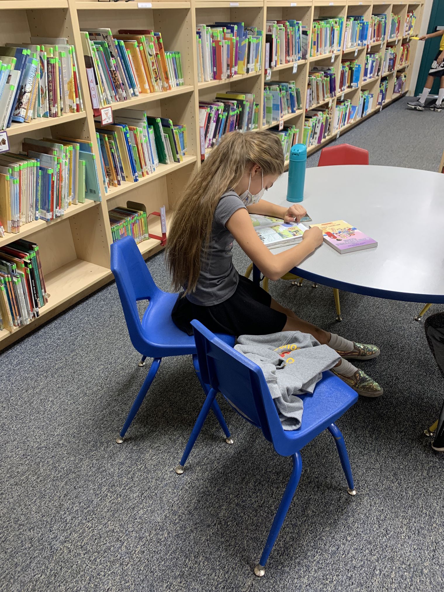 Student reading in the library
