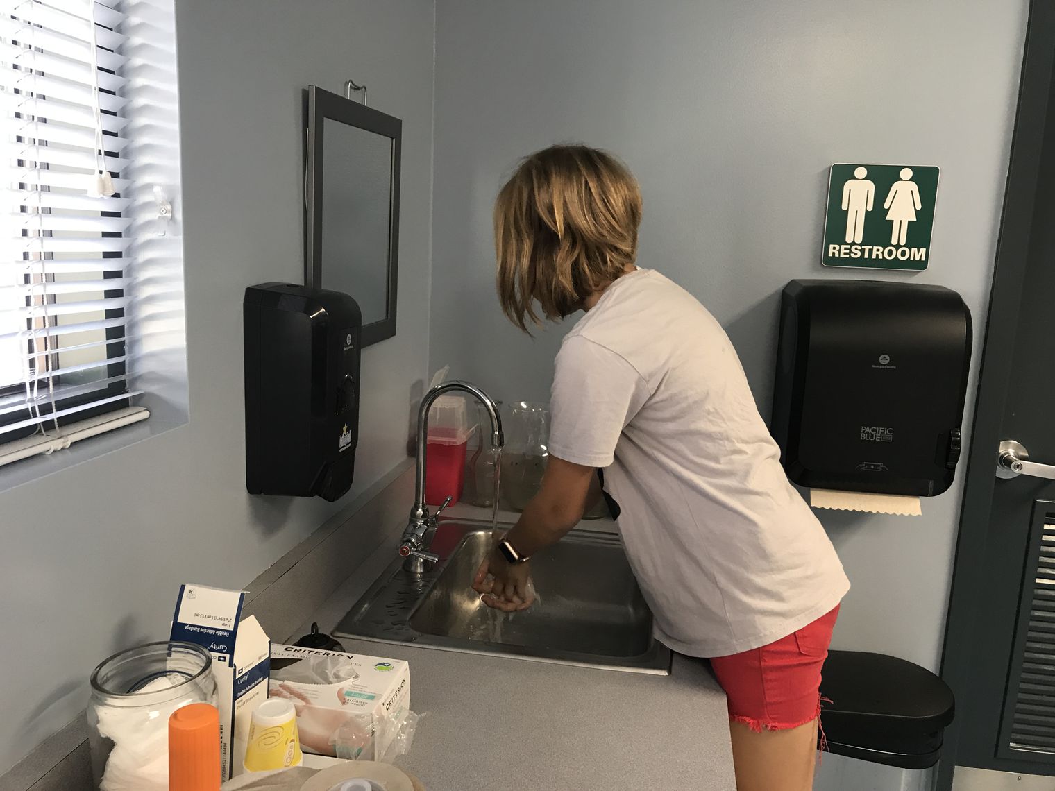 Student washing her hands