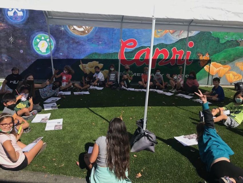 Students working outside.