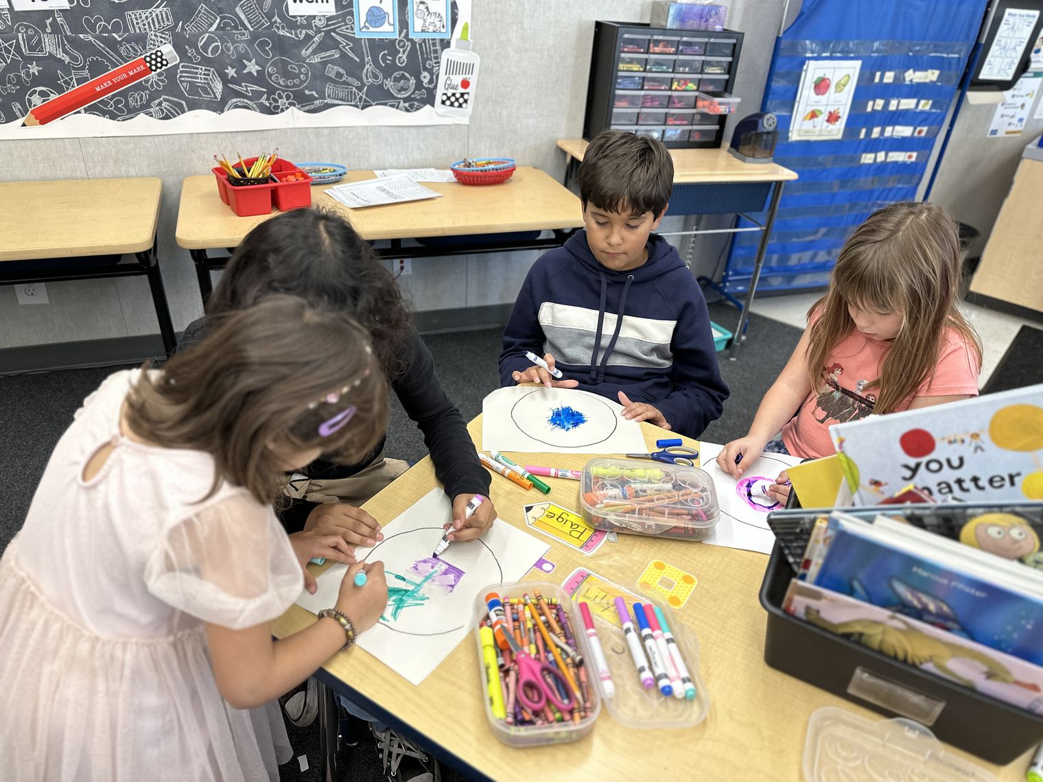Students making snowflakes