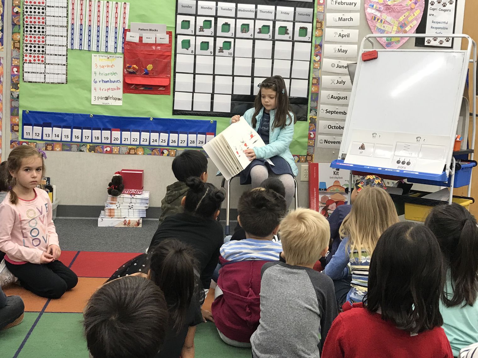 The Principal reading to students