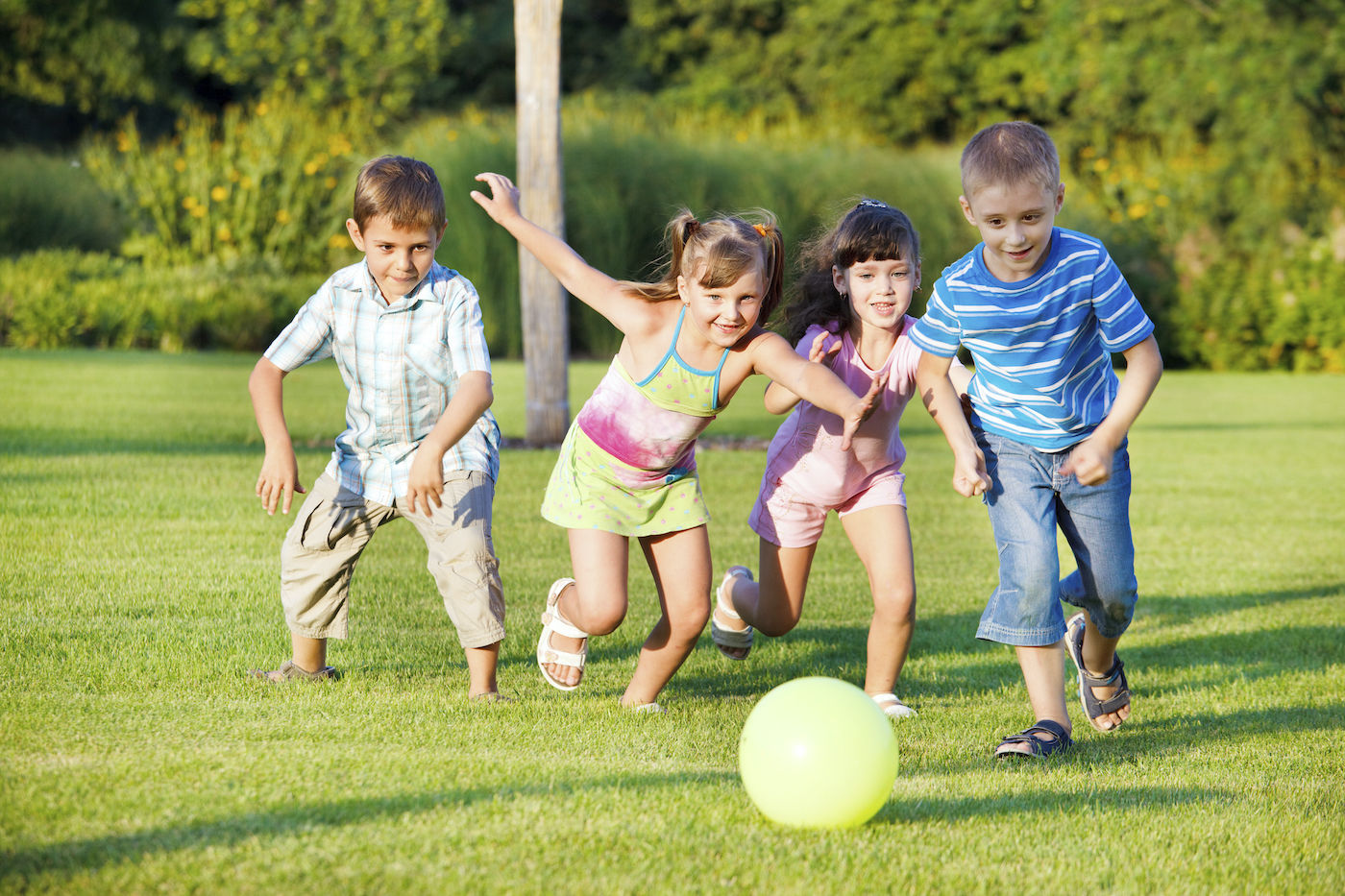 Kids playing and running with a ball