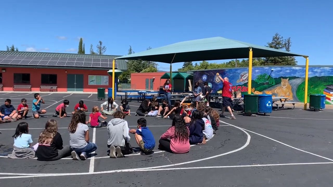Mr. Brown and 5th Graders playing games.
