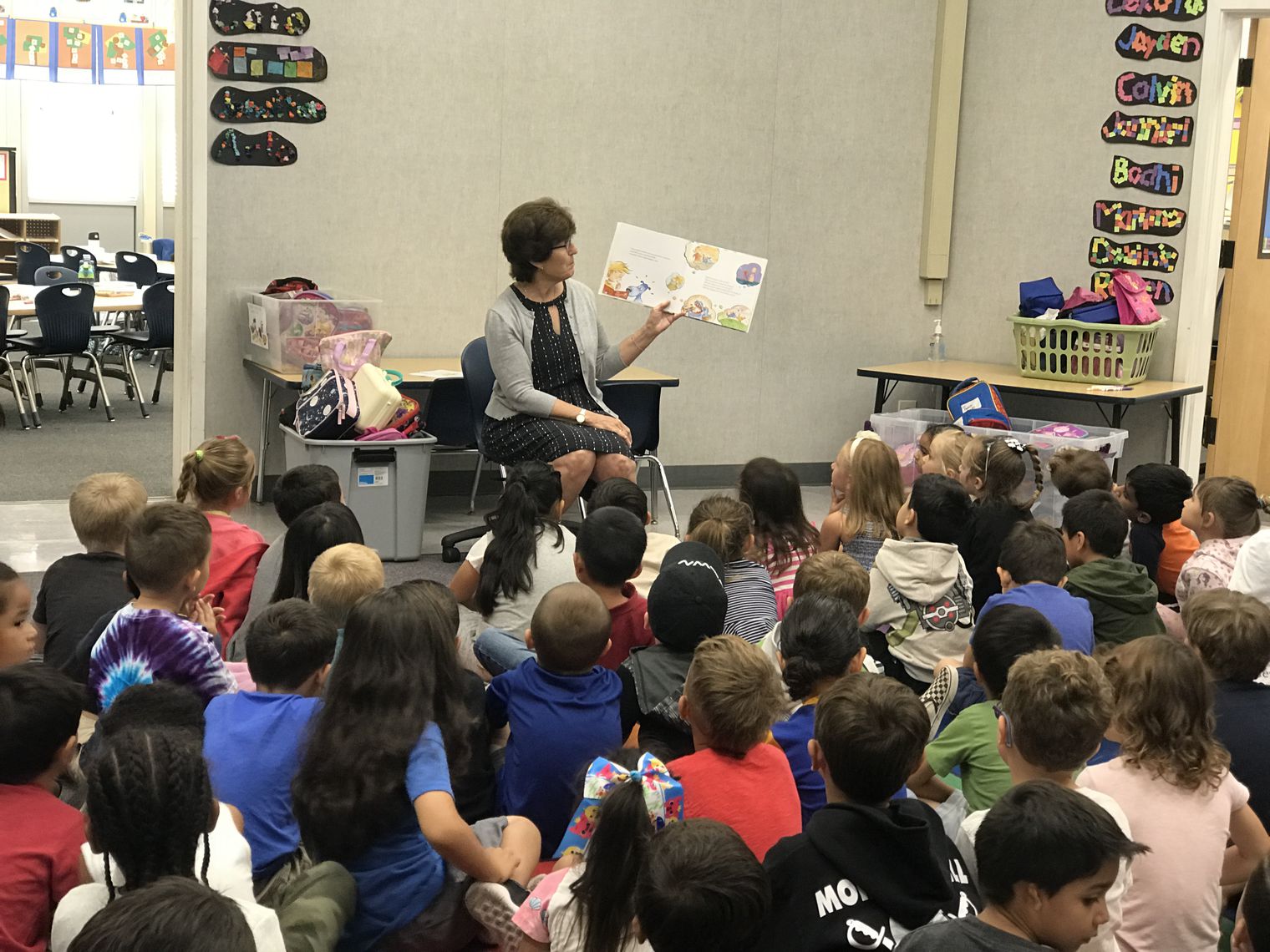An Adult reading to students