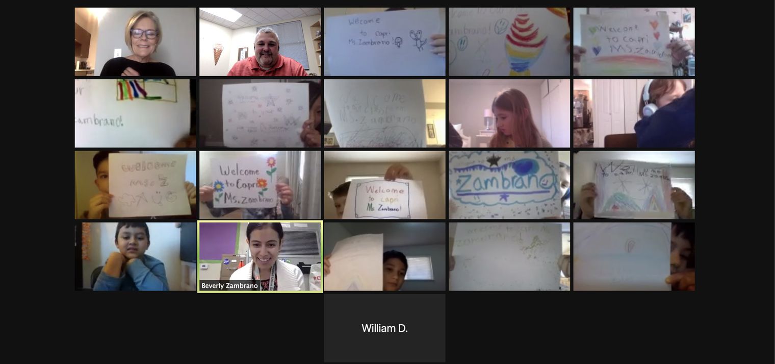 Zoom screenshot of students with signs