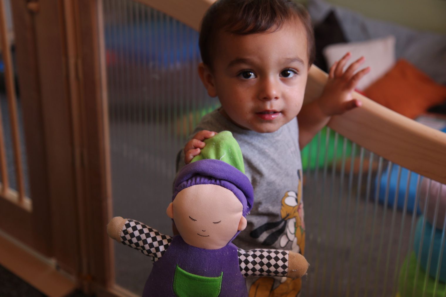 child holding doll