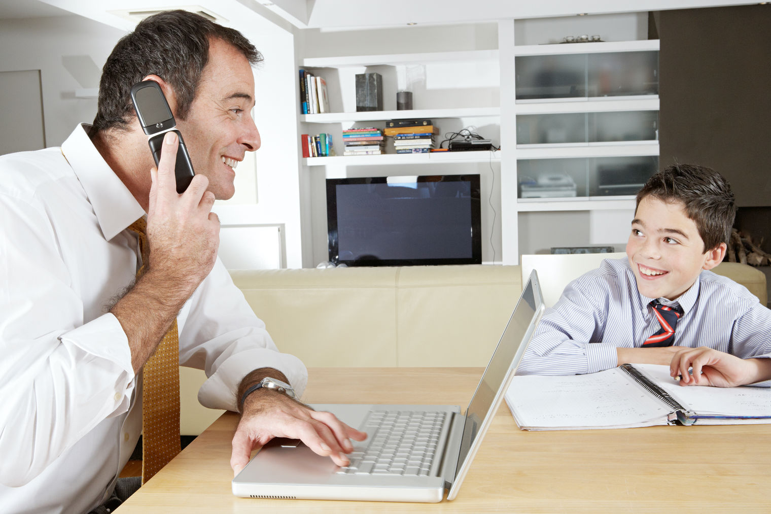 Dad and son working and learning together