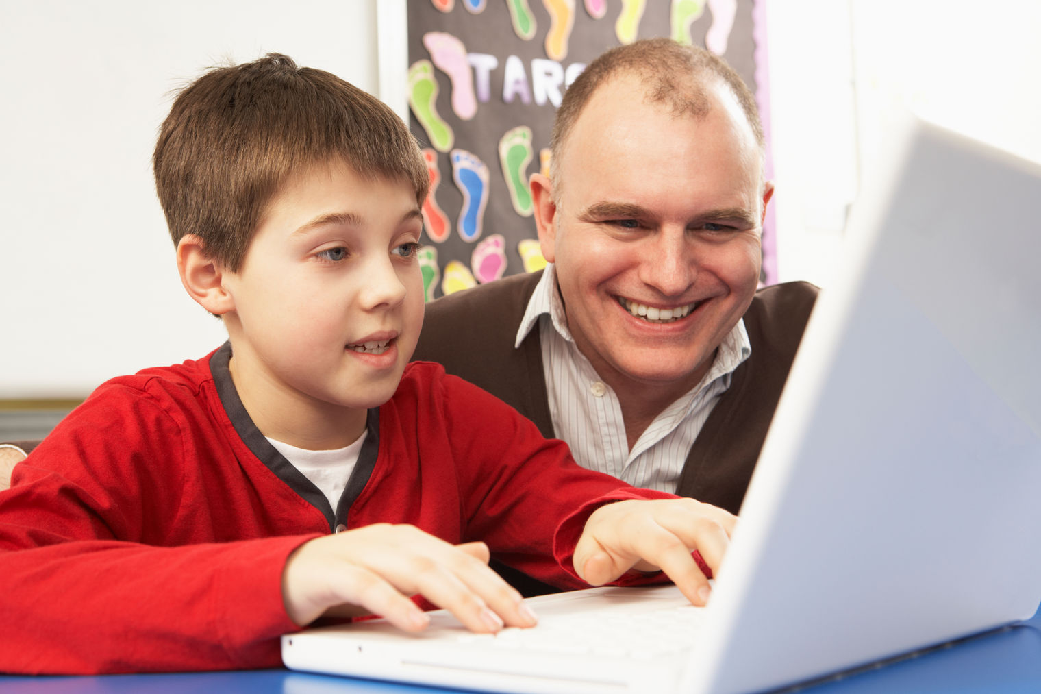Dad and son looking at computer