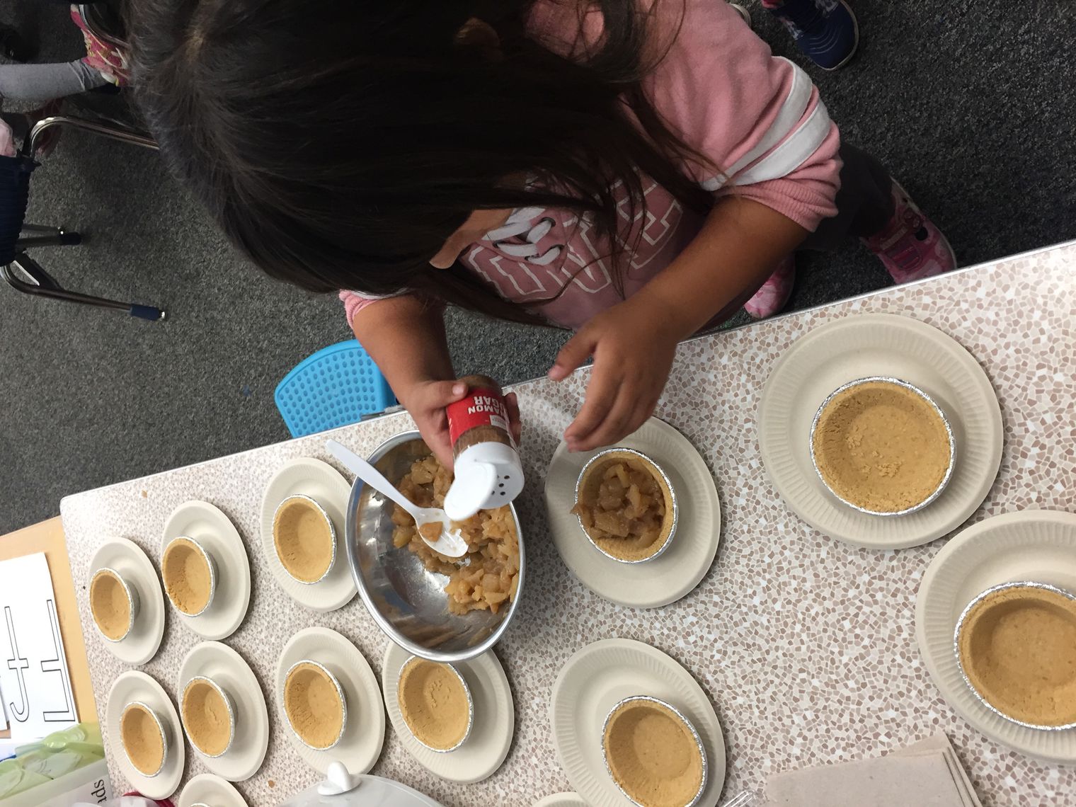 Student making an apple pie
