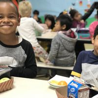 Two boys eating lunch