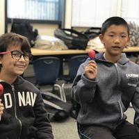 Two students in music class