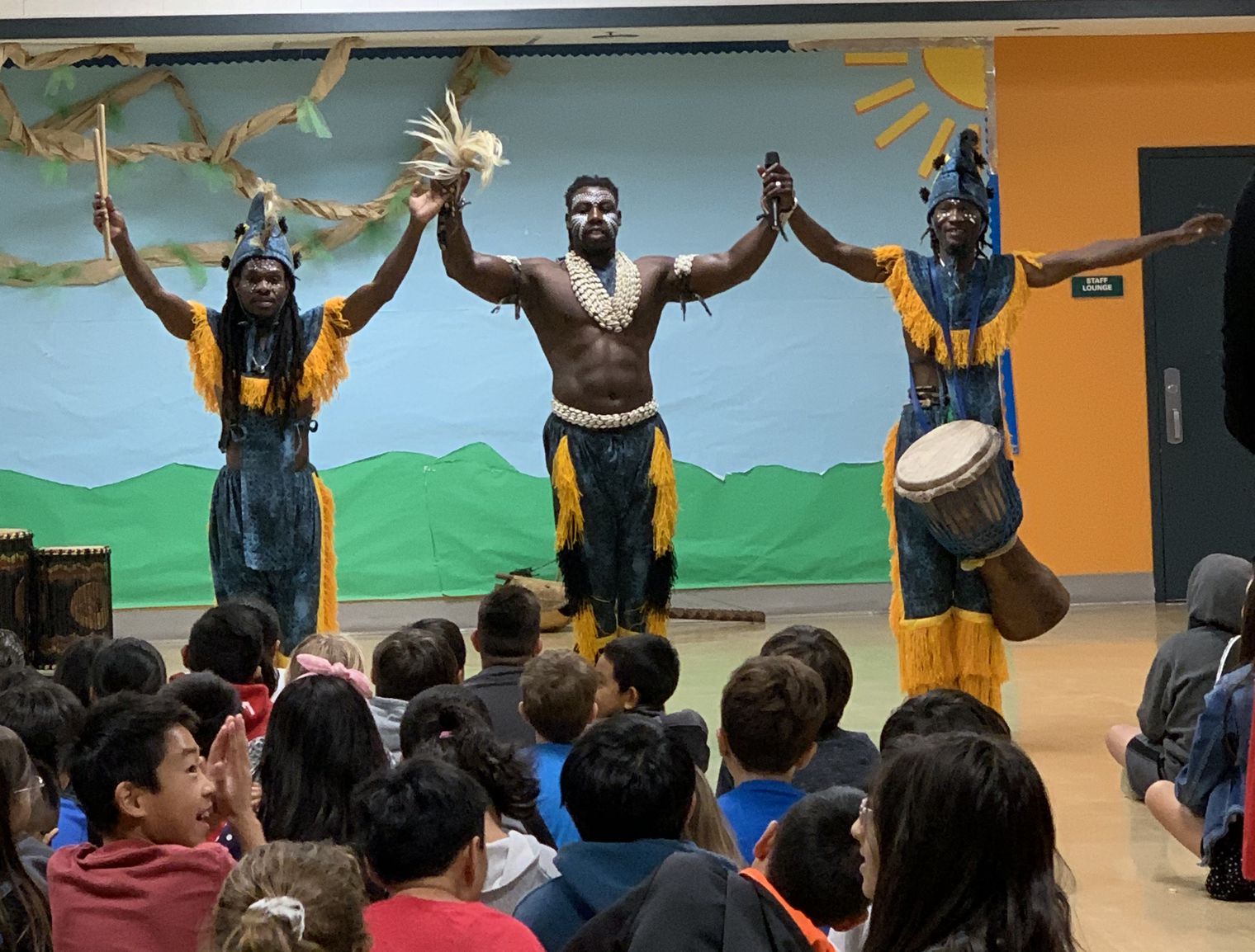 3 men in traditional African dress