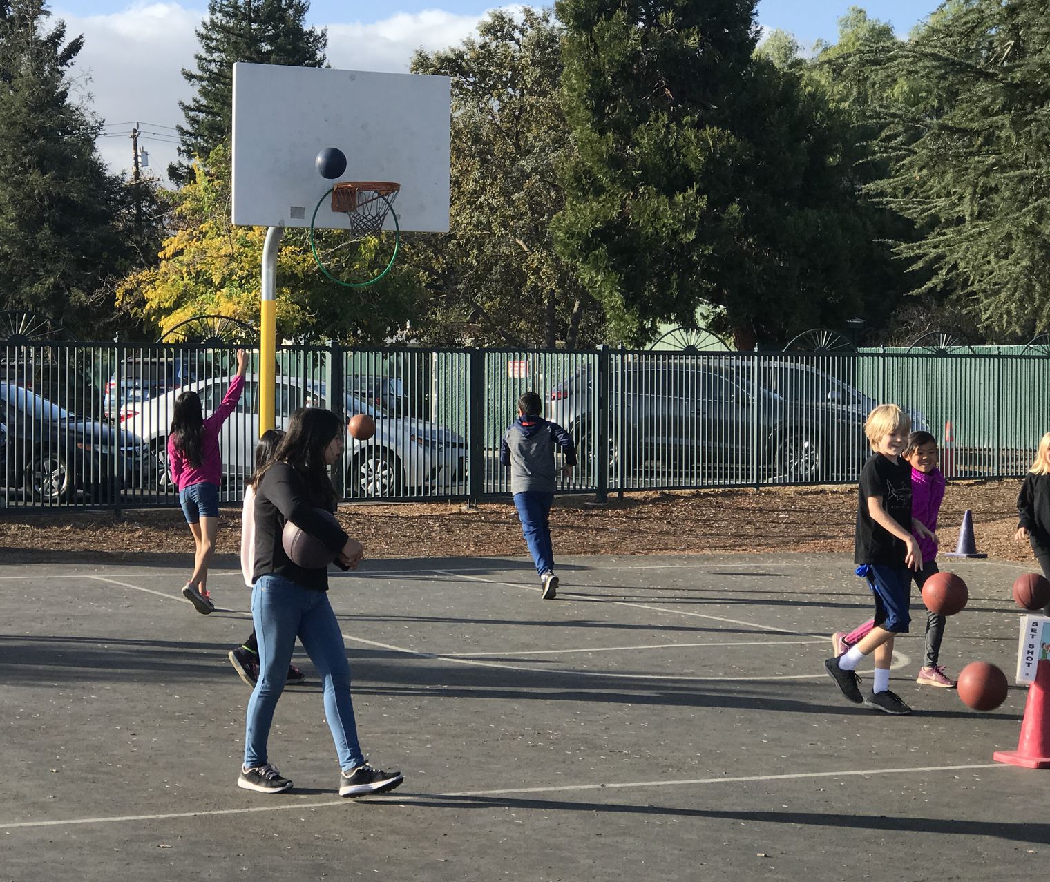 students playing basketball