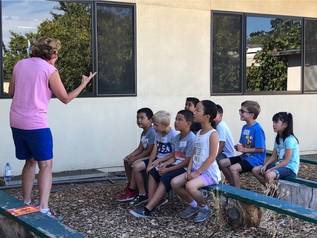 Students listening to a teacher